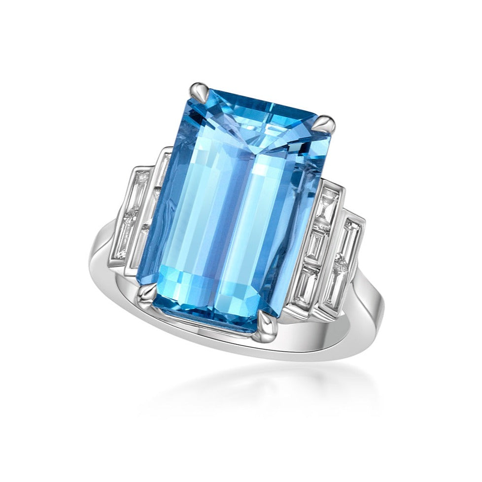 5.16ct Octagonal Blue Aquamarine in a handmade 18K White Gold Cocktail ring setting with straight baguette side stones