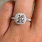 1.01ct Round Brilliant diamond with a Platinum Cushion Diamond Halo Engagement ring setting and custom basket detailing