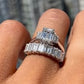 1.54ct Emerald cut diamond in an 18K White Gold engagement ring setting with Trapeze Diamond Sidestones