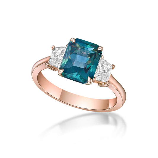 2.40ct Octagonal Mixed-cut Blue Green Sapphire in a handmade 18K Rose Gold 3-stone setting with Trapeze diamond sidestones