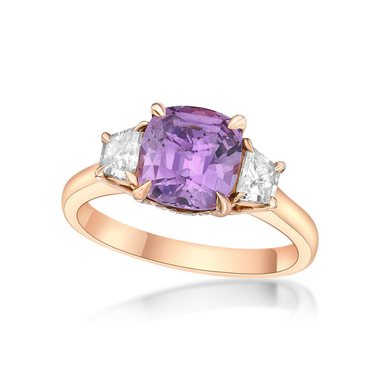 2.63ct Cushion-cut Purple Spinel in a handmade 18K Rose Gold 3-stone basket setting, matching 22pt Trapeze diamond sidestones, and bezel set round brilliant diamond under bridge of the ring